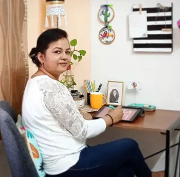 Ankita J mehta Ankita Mehta sitting down to make her digital illustrations and art using her digital devices