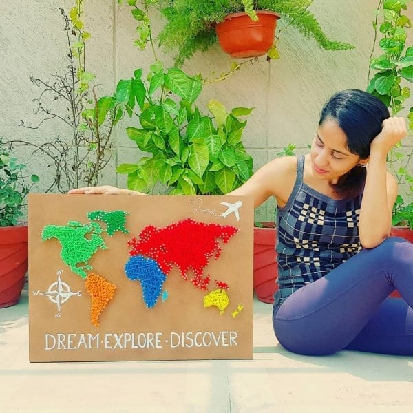 Sonal Malhotra with her creation of world map on String art.
